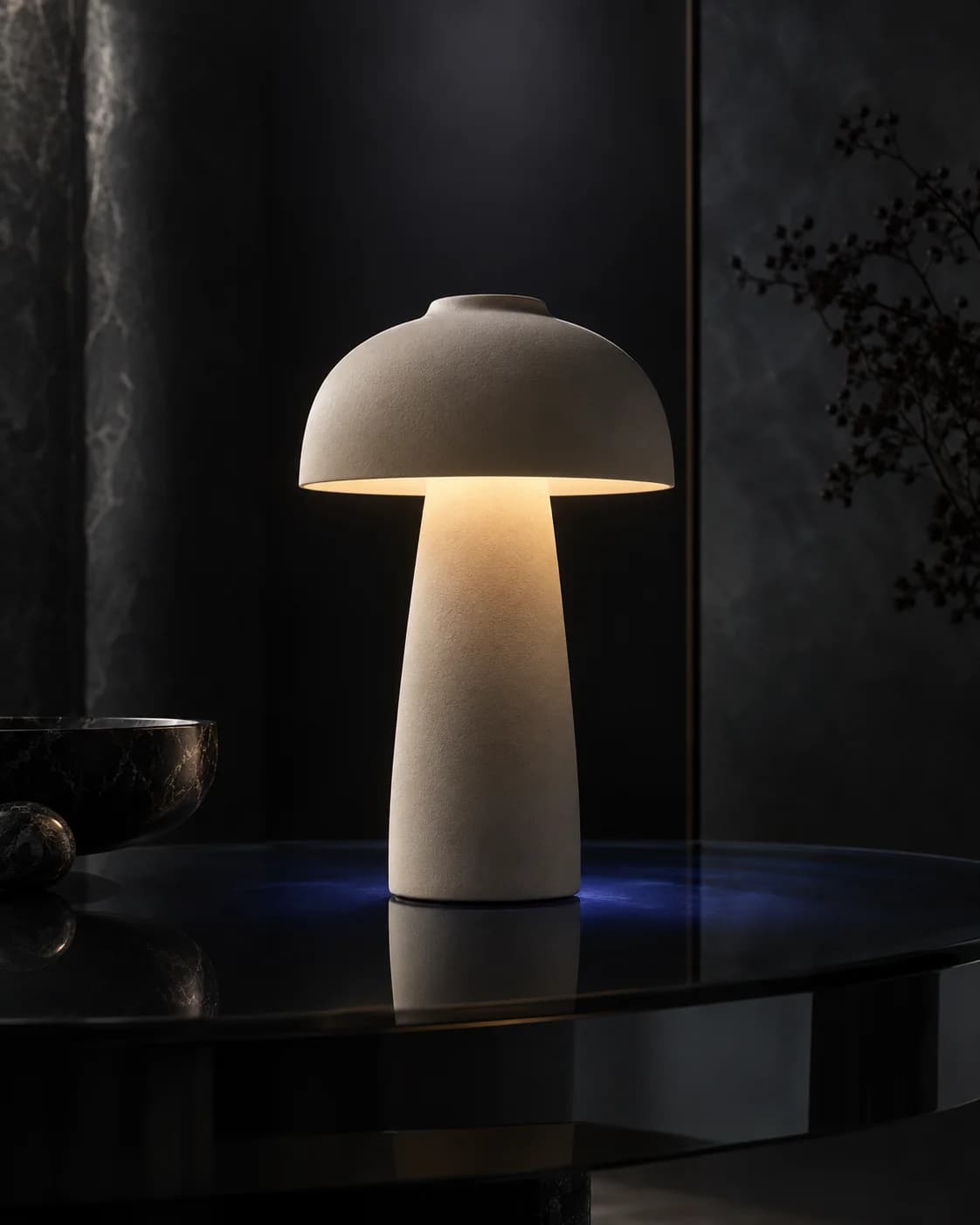 a mushroom-shaped metal lamp; a cool blue prism flare; black lacquer